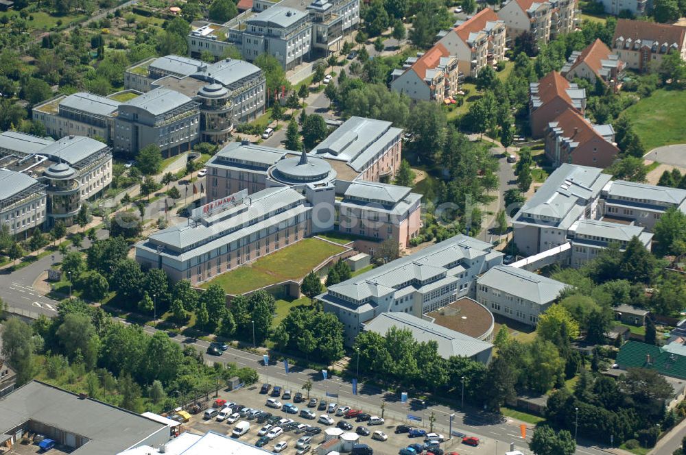 Magdeburg from above - Blick auf das Ramada Hotel in Magdeburg. Das 4- Sterne- Hotel gehört zur RAMADA Worldwide- Kette. Das Hotel verfügt über 243 Hotelzimmer und Suiten. Das Hotel besitzt einen Fitness- und Wellnessbereich. View of the Ramada Hotel in Magdeburg. The four star hotel is part of the Ramada Worldwide chain. The hotel has 243 rooms and suites. The hotel has a fitness and wellness area.