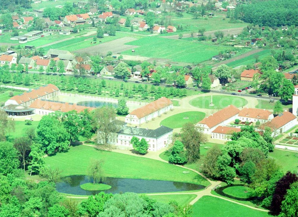 Aerial image Neuhardenberg (ehem. Marxwalde) / Brandenburg - Hotel Schloss Neuhardenberg am Tage der Wiedereröffnung nach umfangreichen Restaurations- und Sanierungsarbeiten. Inmitten eines von Peter Joseph Lenné und Hermann Fürst von Pückler-Muskau gestalteten Landschaftparks gelegen, bietet Hotel Schloss Neuhardenberg Komfort und Ruhe. Es verfügt über Räumlichkeiten verschiedener Größe für Gespräche, Tagungen und Konferenzen, aber auch für Feierlichkeiten. Für die Planung und Gestaltung von Konferenzen, Tagungen und Gesprächen und des entsprechenden kulturellen und kulinarischen Begleitprogramms unterbreitet Ihnen der Veranstaltungsservice von Hotel Schloss Neuhardenberg unter der Telefonnummer +49 (0)30 - 889 290-15 gerne detaillierte Arrangementvorschläge. Einzelreservierungen werden unter der Telefonnummer +49 (0)30 - 889 290-0 entgegen genommen. Hotel Schloss Neuhardenberg wird in Zusammenarbeit mit den Althoff Hotels betrieben. Neuhardenberg 08.05.2001