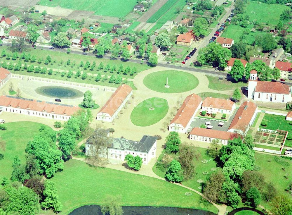 Aerial image Neuhardenberg (ehem. Marxwalde) / Brandenburg - Hotel Schloss Neuhardenberg am Tage der Wiedereröffnung nach umfangreichen Restaurations- und Sanierungsarbeiten. Inmitten eines von Peter Joseph Lenné und Hermann Fürst von Pückler-Muskau gestalteten Landschaftparks gelegen, bietet Hotel Schloss Neuhardenberg Komfort und Ruhe. Es verfügt über Räumlichkeiten verschiedener Größe für Gespräche, Tagungen und Konferenzen, aber auch für Feierlichkeiten. Für die Planung und Gestaltung von Konferenzen, Tagungen und Gesprächen und des entsprechenden kulturellen und kulinarischen Begleitprogramms unterbreitet Ihnen der Veranstaltungsservice von Hotel Schloss Neuhardenberg unter der Telefonnummer +49 (0)30 - 889 290-15 gerne detaillierte Arrangementvorschläge. Einzelreservierungen werden unter der Telefonnummer +49 (0)30 - 889 290-0 entgegen genommen. Hotel Schloss Neuhardenberg wird in Zusammenarbeit mit den Althoff Hotels betrieben. Neuhardenberg 08.05.2001