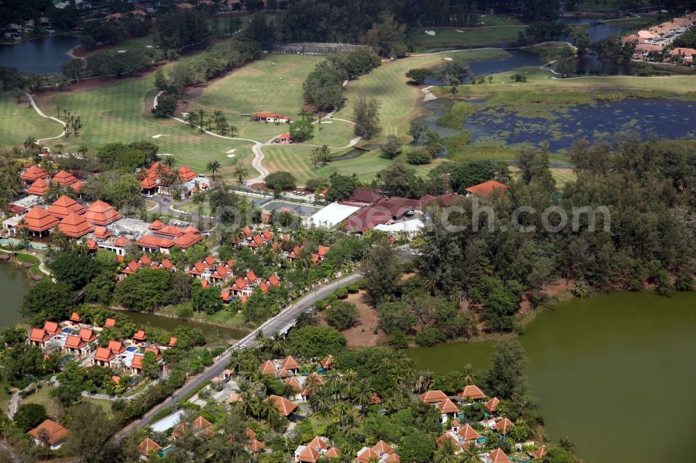 Aerial image Choeng Thale - Resort and golf course with cottages partially of typical architectural style of buildings in Choeng Thale on the island of Phuket in Thailand