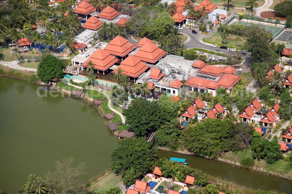 Choeng Thale from above - Resort and golf course with cottages partially of typical architectural style of buildings in Choeng Thale on the island of Phuket in Thailand