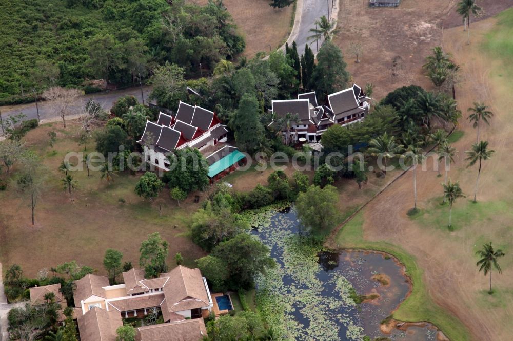 Choeng Thale from above - Resort and golf course with cottages partially of typical architectural style of buildings in Choeng Thale on the island of Phuket in Thailand