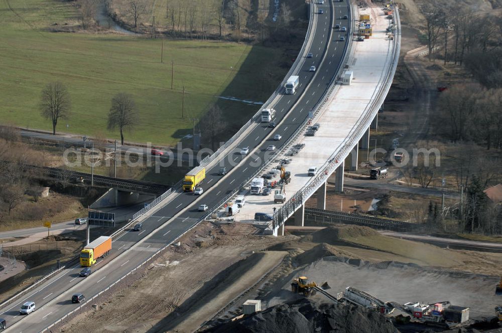 Aerial photograph Sättelstädt - Blick auf die neue Hörseltalbrücke nach der teilweisen Verkehrsfreigabe des neuen A4- Autobahnverlaufes. Die Brücke ist Teil des Projekt Nordverlegung / Umfahrung Hörselberge der Autobahn E40 / A4 in Thüringen bei Eisenach. Durchgeführt werden die im Zuge dieses Projektes notwendigen Arbeiten unter an derem von den Mitarbeitern der Niederlassung Weimar der EUROVIA Verkehrsbau Union sowie der Niederlassungen Abbruch und Erdbau, Betonstraßenbau, Ingenieurbau und TECO Schallschutz der EUROVIA Beton sowie der DEGES. View at the new Hörselthal- bridge after the partial opening to traffic of the new A4 motorway course.