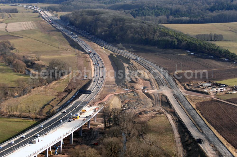 Aerial photograph Sättelstädt - Blick auf die neue Hörseltalbrücke nach der teilweisen Verkehrsfreigabe des neuen A4- Autobahnverlaufes. Die Brücke ist Teil des Projekt Nordverlegung / Umfahrung Hörselberge der Autobahn E40 / A4 in Thüringen bei Eisenach. Durchgeführt werden die im Zuge dieses Projektes notwendigen Arbeiten unter an derem von den Mitarbeitern der Niederlassung Weimar der EUROVIA Verkehrsbau Union sowie der Niederlassungen Abbruch und Erdbau, Betonstraßenbau, Ingenieurbau und TECO Schallschutz der EUROVIA Beton sowie der DEGES. View at the new Hörselthal- bridge after the partial opening to traffic of the new A4 motorway course.