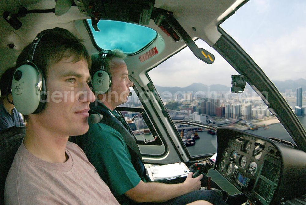 Aerial photograph Hongkong - Hubschrauberflug ueber Hongkong mit blick in das Cockpit mit Pilot. Hongkong sightseeing flight with a helicopter, cockpit, pilot.