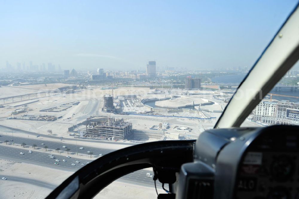 Dubai from above - Flight over the urban development area Dubai Culture Village at the shores of Dubai Creek. Dubai Culture Village is a multi-purpose development project which will include a harbour and several cultural and exhibition centres