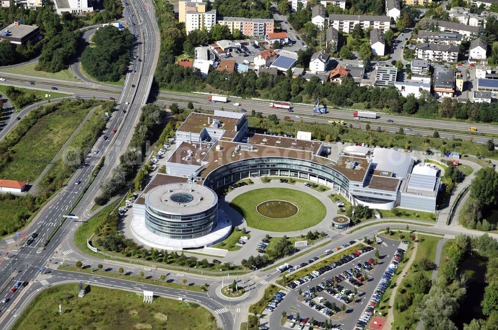 Aerial photograph Rüsselsheim - Hyndai Motor Europe Technical Center GmbH im Gewerbepark / Business Park Blauer See am Verkehrsknotenpunkt Rüsselsheimer Dreieck im Rhein-Main-Gebiet. Das Büro- und Dienstleistungszentrum ist ein Projekt der HVB Immobilien AG. The industrial park Blauer See in the Rhine-Main region.