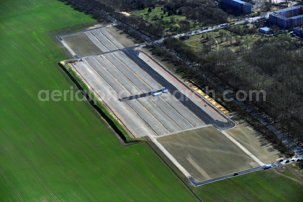 Aerial photograph Hönow - Parking and storage space for automobiles along the Berliner Allee to the IGA Internationale Gartenausstellung in Hoenow in the state Brandenburg