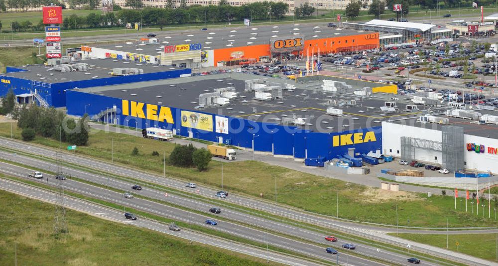 Aerial photograph Danzig / Gdansk - Blick auf das Gewerbegebiet mit dem IKEA Einrichtungshaus, Baumarkt OBI an der Schnellstraße E28 Aleja-Kazimierza-Jagiellouczyka in Danzig in Polen. View over trading estate with furnishing house IKEA, DIY market OBI etc. at highway E28 Aleja-Kazimierza-Jagiellouczyka in Gdansk in Poland.