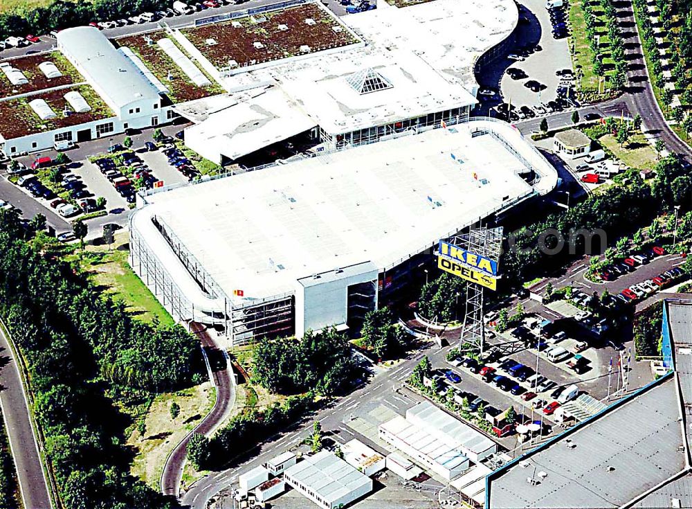 Aerial photograph Kassel / Hessen - IKEA-Einrichtungshaus Kassel an der Bundesautobahn A49/ Konrad-Zuse Straße/ Heinrich-Herz Straße. Mit im Bild das neu errrichtete Parkdeck sowie der an die OPEL-Niederlassung Kassel vermiete Grundbesitz