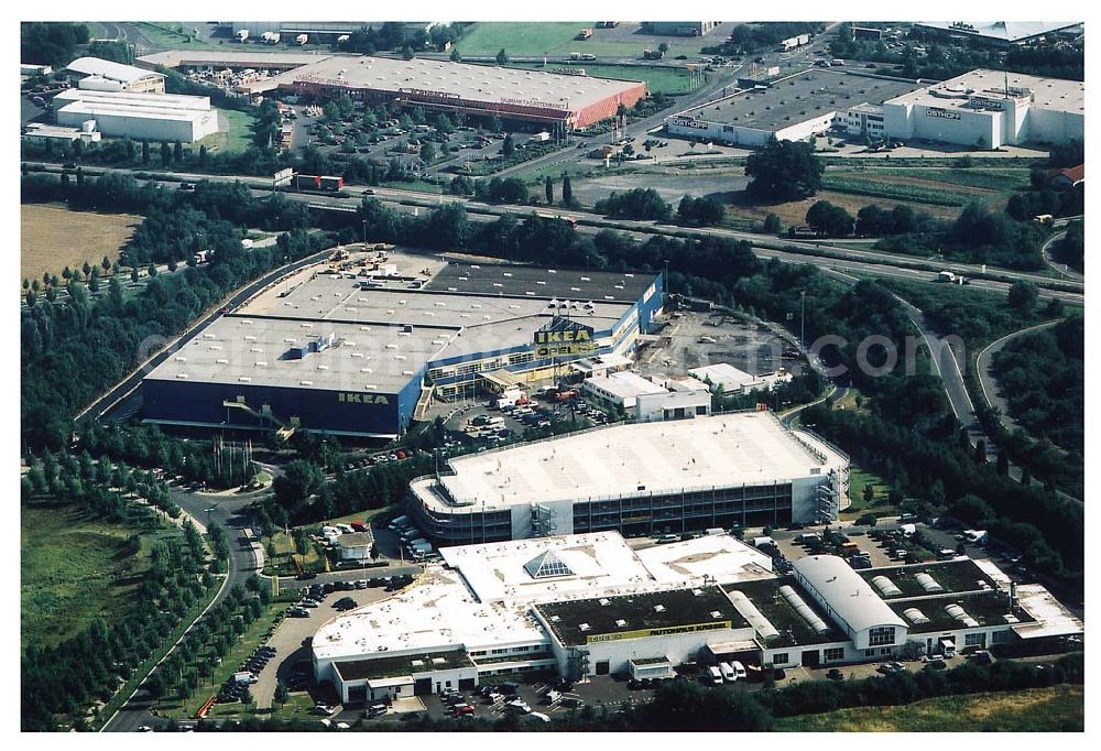 Aerial photograph Kassel / Hessen - IKEA-Einrichtungshaus Kassel an der Bundesautobahn A49/ Konrad-Zuse Straße/ Heinrich-Herz Straße. Mit im Bild das neu errrichtete Parkdeck sowie der an die OPEL-Niederlassung Kassel vermiete Grundbesitz