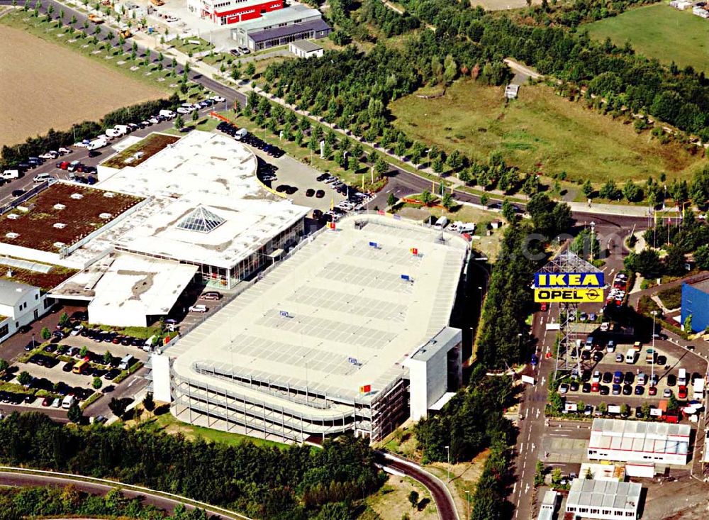 Kassel / Hessen from above - IKEA-Einrichtungshaus Kassel an der Bundesautobahn A49/ Konrad-Zuse Straße/ Heinrich-Herz Straße. Mit im Bild das neu errrichtete Parkdeck sowie der an die OPEL-Niederlassung Kassel vermiete Grundbesitz