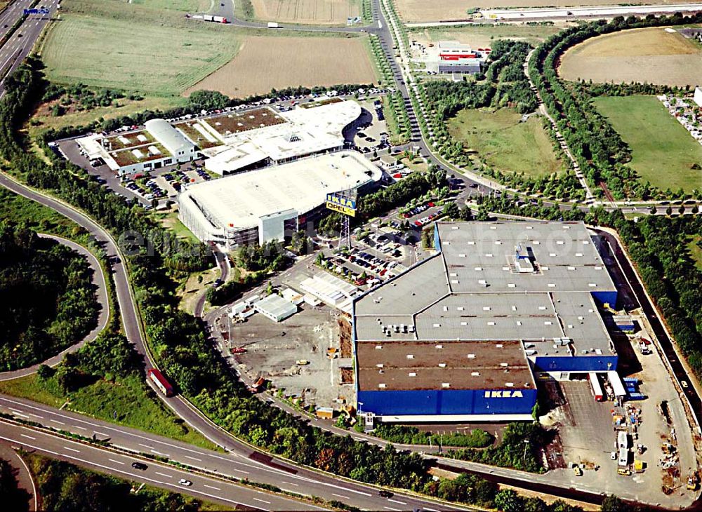 Aerial photograph Kassel / Hessen - IKEA-Einrichtungshaus Kassel an der Bundesautobahn A49/ Konrad-Zuse Straße/ Heinrich-Herz Straße. Mit im Bild das neu errrichtete Parkdeck sowie der an die OPEL-Niederlassung Kassel vermiete Grundbesitz