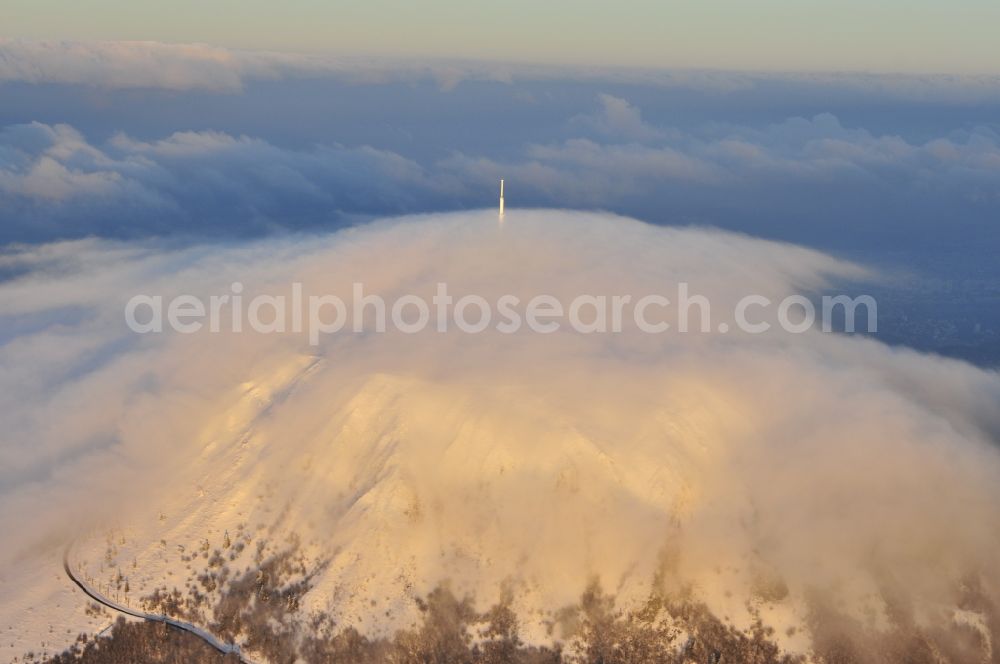 Aerial image Puy de Dome - In veiled sunset with fog volcanic mountain Puy-de-Dome in the province of Auvergne in France