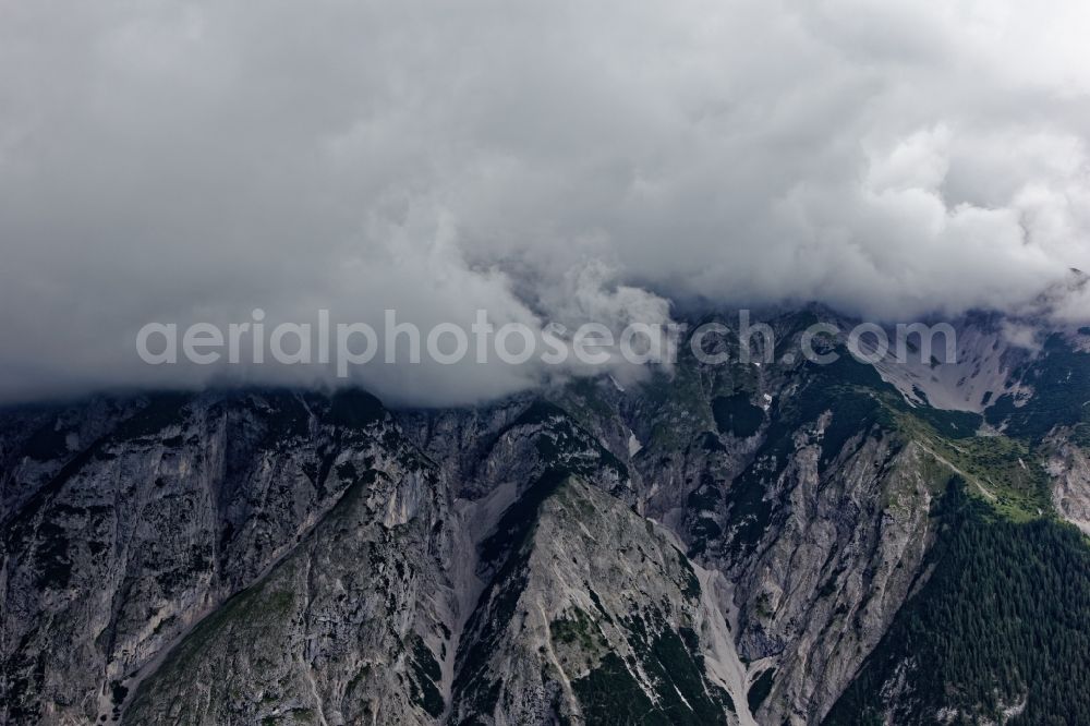 Innsbruck from above - Rocky and mountainous landscape with Hechenberg peak in clouds in Innsbruck in Tirol, Austria