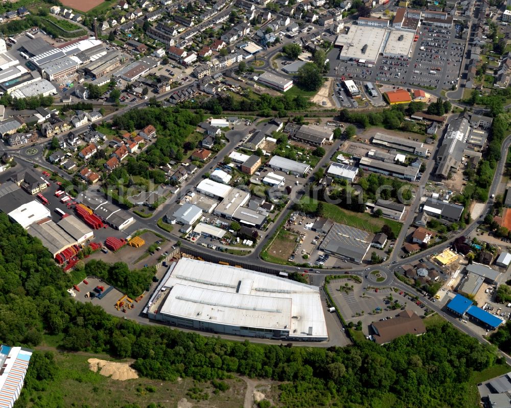 Aerial photograph Bendorf - View of the town of Bendorf in the state of Rhineland-Palatinate. The town is located in the county district of Mayen-Koblenz on the right riverbank of the river Rhine. The town is an official tourist resort and is located on the German Limes Road. The commercial area is located in the centre of the town and includes Coca-Cola facilities and a Kaufland super-market