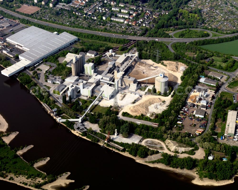 Aerial image Neuwied - Industrial and commercial area of Dyckerhoff AG on the river course of the Rhine in Neuwied in Rhineland-Palatinate