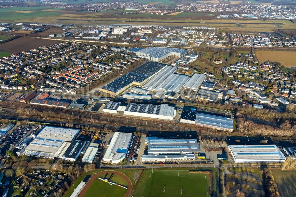 Aerial image Holzwickede - Industrial and commercial area overlooking the company premises of Montanhydraulik GmbH on Bahnhofstrasse - Montanhydraulikstrasse and the KODA Stanz- und Biegetechnik GmbH on August-Borsig-Strasse in Holzwickede in the state North Rhine-Westphalia, Germany