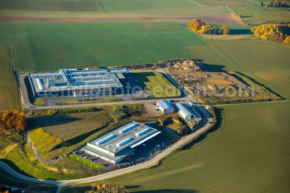 Aerial image Finnentrop - Industrial and commercial area industrial park Wiethfeld in Finnentrop in the state of North Rhine-Westphalia. The park is home to MFP and is surrounded by fields