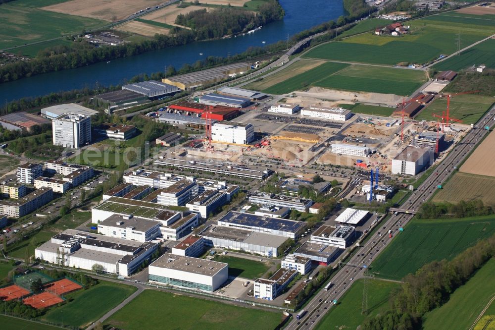 Aerial photograph Kaiseraugst - The location of the company Roche in Kaiseraugst in Switzerland is extended. On the grounds are also the buildings of the DSM