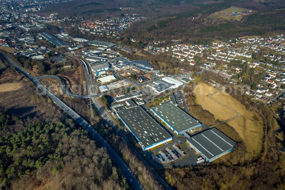 Menden (Sauerland) from the bird's eye view: Industrial and commercial area overlooking the HJS Emission Technology GmbH & Co. KG along the Dieselweg and the MHU Metaform a?? HSM GmbH on Bessemer Weg in Menden (Sauerland) in the state North Rhine-Westphalia, Germany