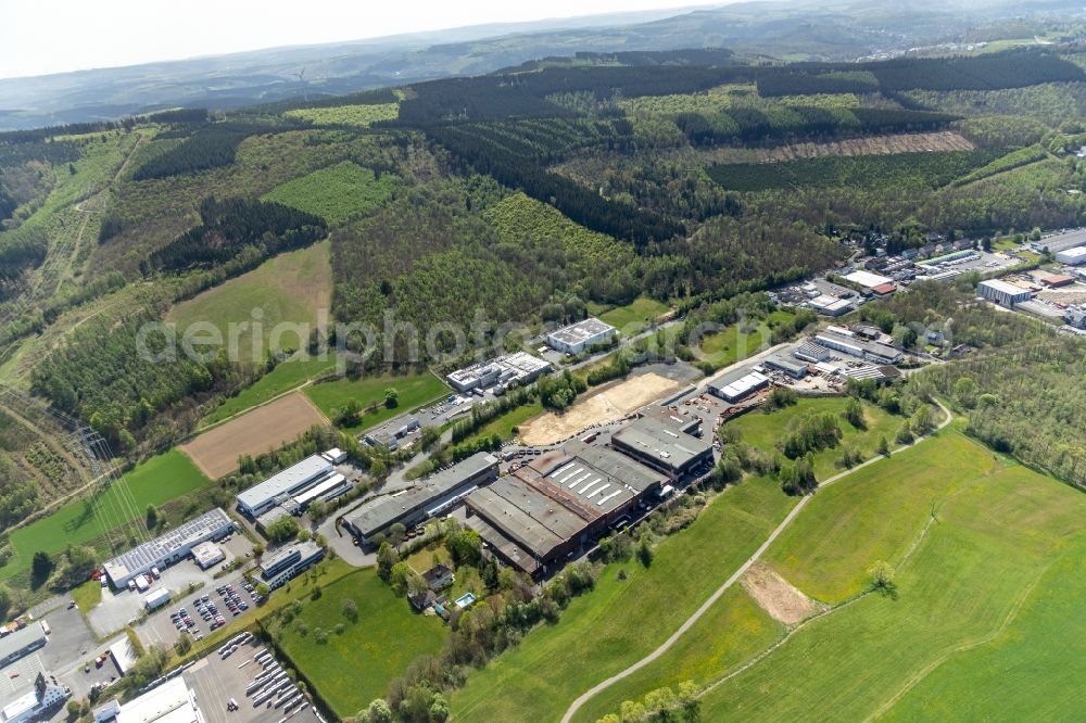 Netphen from the bird's eye view: Industrial and commercial area along the Obere Industriestrasse in Netphen in the state North Rhine-Westphalia, Germany