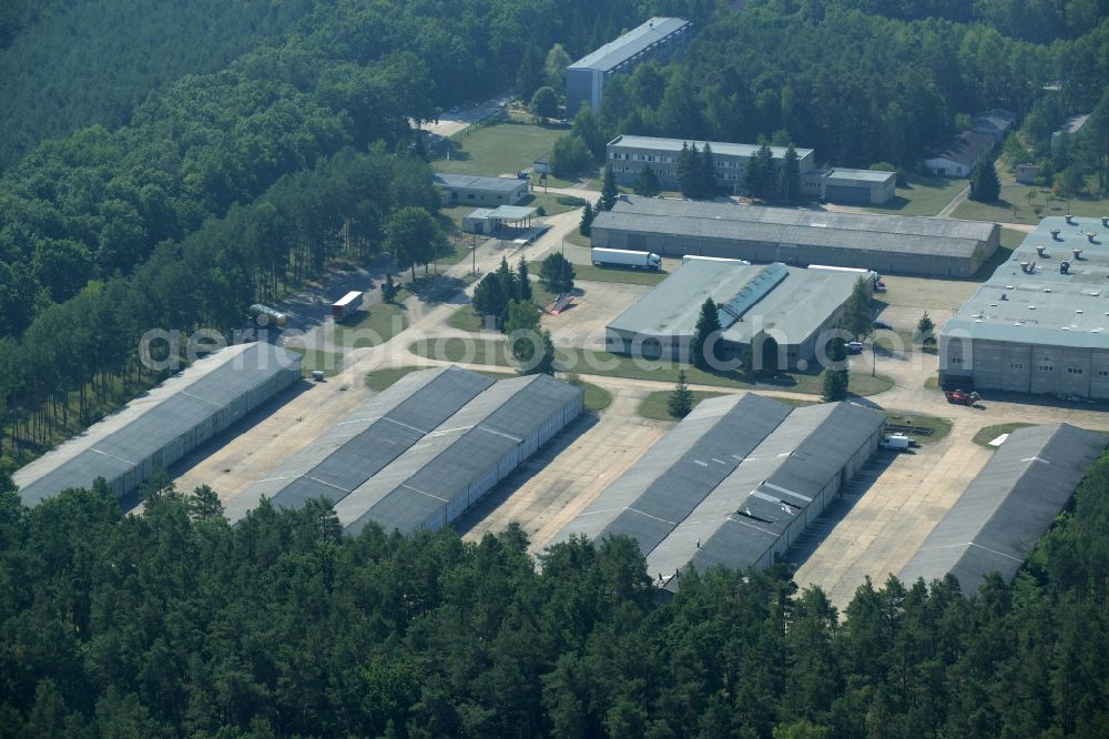 Grünheide (Mark) from above - Industrial and commercial area in the Hangelsberg part of the borough of Gruenheide (Mark) in the state of Brandenburg. The site includes several large halls as well as industrial and office buildings