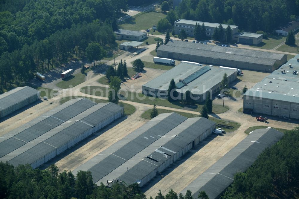 Grünheide (Mark) from the bird's eye view: Industrial and commercial area in the Hangelsberg part of the borough of Gruenheide (Mark) in the state of Brandenburg. The site includes several large halls as well as industrial and office buildings