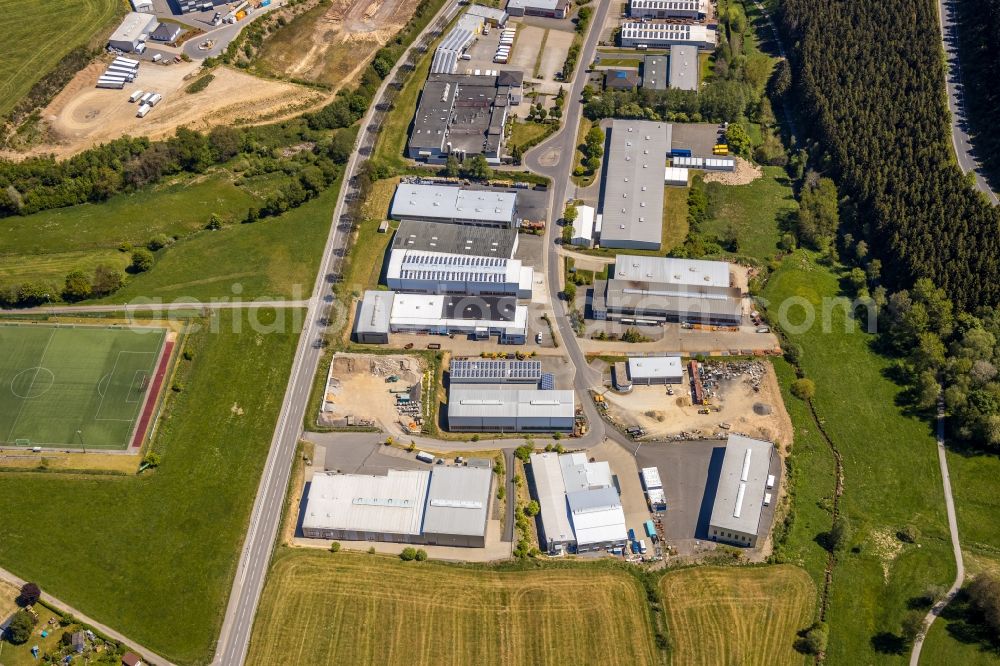 Kirchhundem from the bird's eye view: Industrial and commercial area on Olper Strasse in the district Welschen-Ennest in Kirchhundem at Sauerland in the state North Rhine-Westphalia, Germany