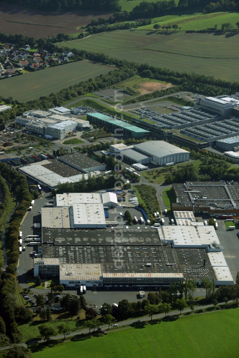 Aerial photograph Melsungen - Industrial and commercial area Pfieffewiesen in Melsungen in the state of Hesse. A logistics and cargo center of EDEKA is located here