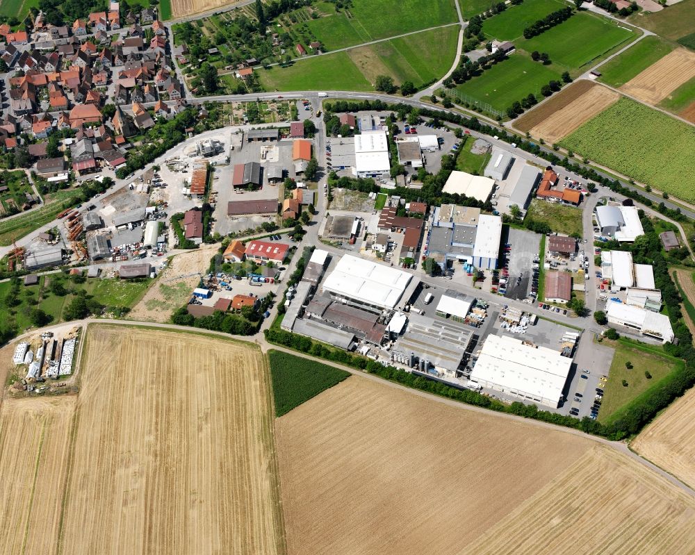 Aerial photograph Dürrenzimmern - Industrial and commercial area on the edge of agricultural fields in Dürrenzimmern in the state Baden-Wuerttemberg, Germany