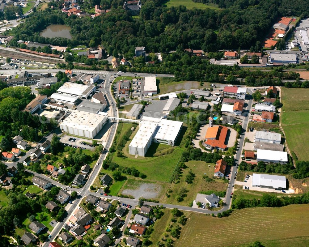 Aerial photograph Felsenkeller - Industrial and commercial area on the edge of agricultural fields in Felsenkeller in the state Hesse, Germany