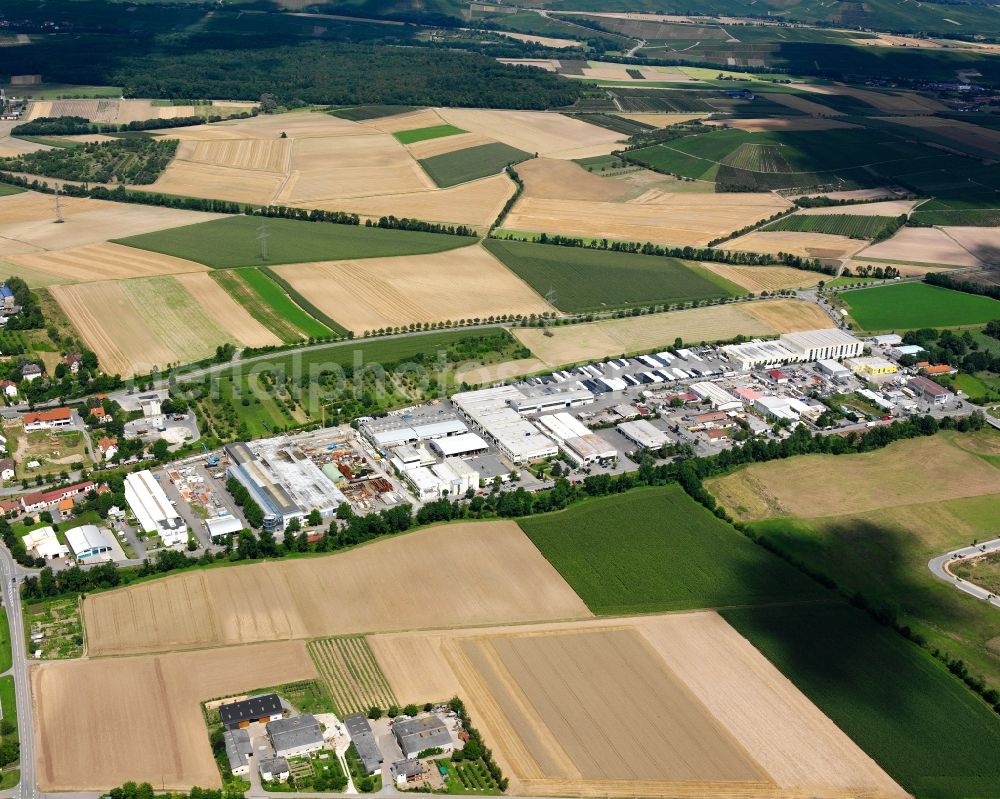 Aerial image Frauenzimmern - Industrial and commercial area on the edge of agricultural fields in Frauenzimmern in the state Baden-Wuerttemberg, Germany