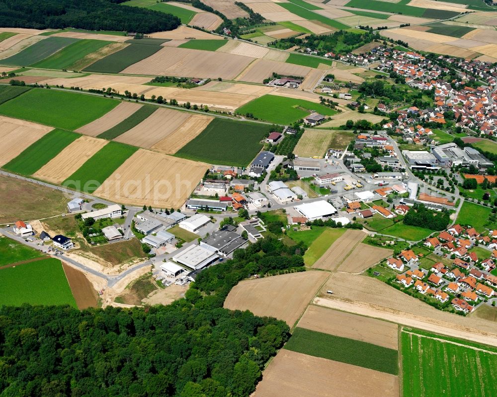 Massenbachhausen from the bird's eye view: Industrial and commercial area on the edge of agricultural fields in Massenbachhausen in the state Baden-Wuerttemberg, Germany