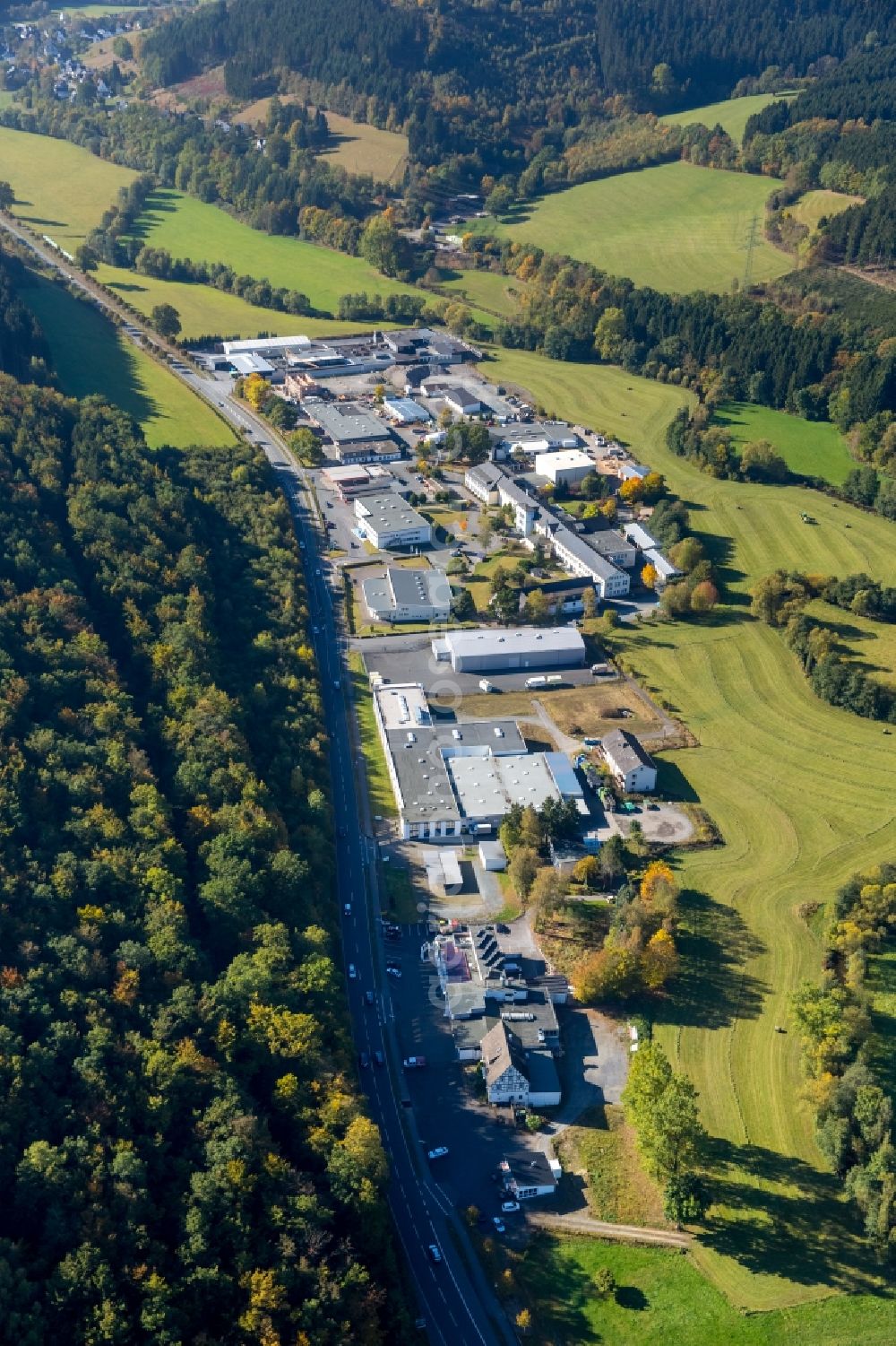 Aerial image Schmallenberg - Industrial and commercial area in the Fleckenberger street with social service center st. Georg e.V. - department of intellectual disability and a Esso filling station in Schmallenberg in the state North Rhine-Westphalia