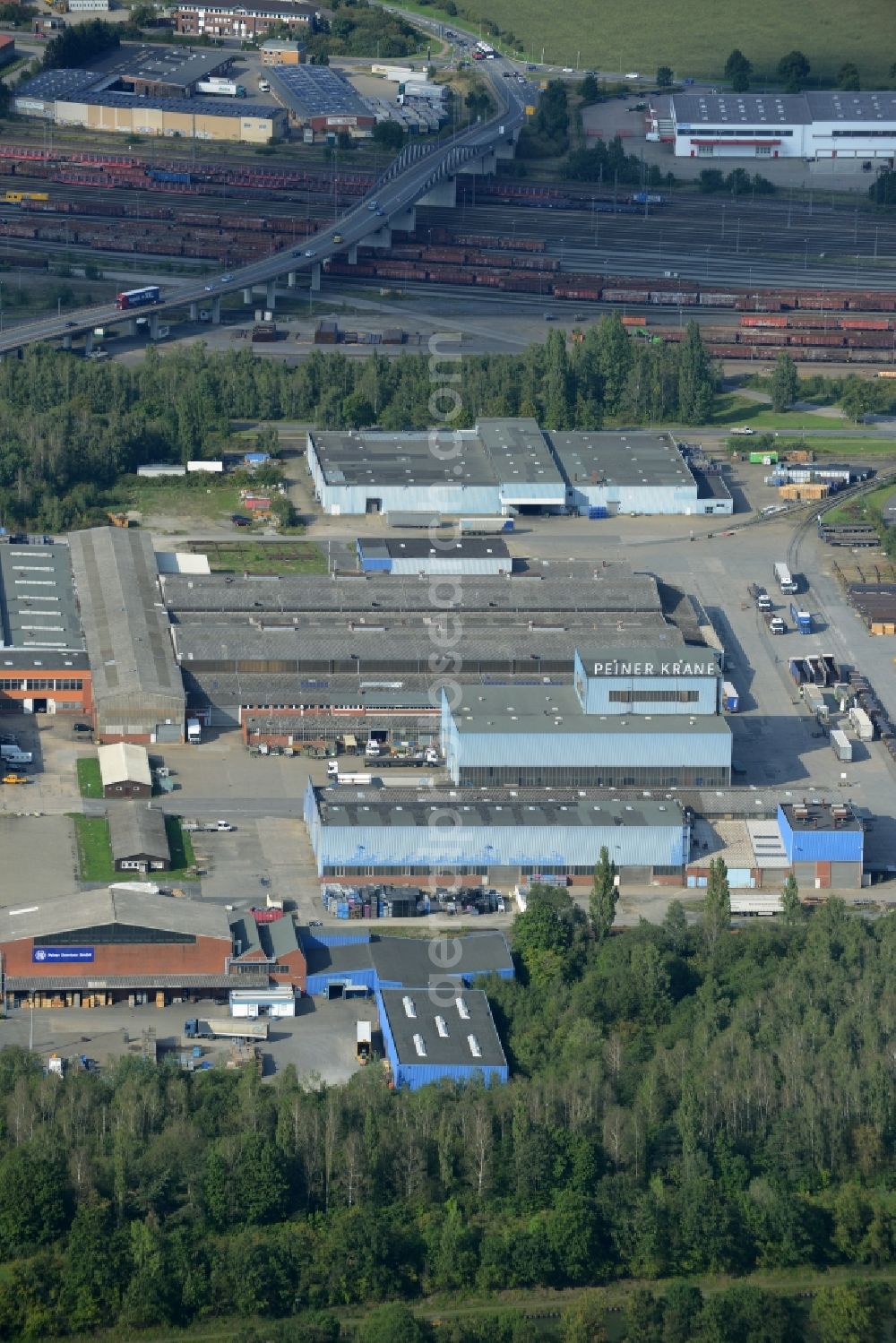 Peine from the bird's eye view: Industrial and commercial area Am Stahldorf in Peine in the state of Lower Saxony. Several companies have their buildings and production sites here - mostly of the steel industry