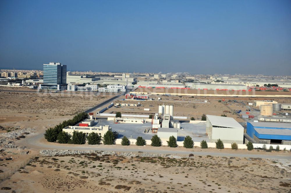 Aerial photograph Ras Al Khaimah - Industrial and commercial area around the Free Trade Zone Ras Al Khaimah near Al Hamra Village. The Free Trade Zone Ras Al Khaimah, or RAK FTZ, is one of the fastest growing free trade zones in the United Arab Emirates. The RAK FTZ has five facilites