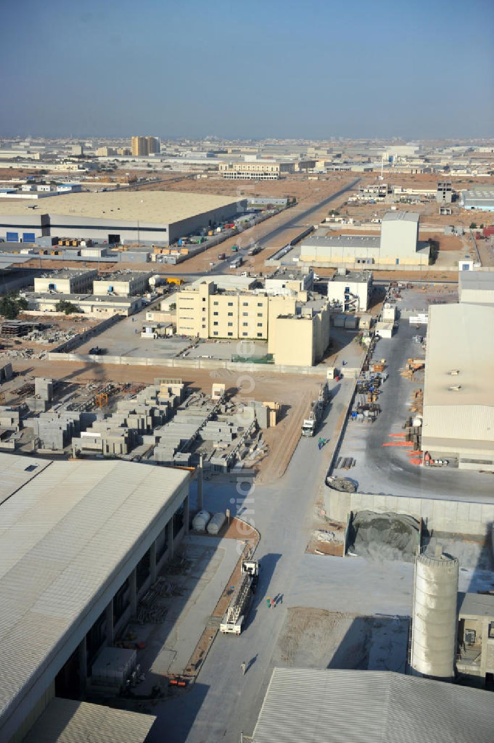 Aerial photograph Ras Al Khaimah - Industrial and commercial area around the Free Trade Zone Ras Al Khaimah near Al Hamra Village. The Free Trade Zone Ras Al Khaimah, or RAK FTZ, is one of the fastest growing free trade zones in the United Arab Emirates. The RAK FTZ has five facilites