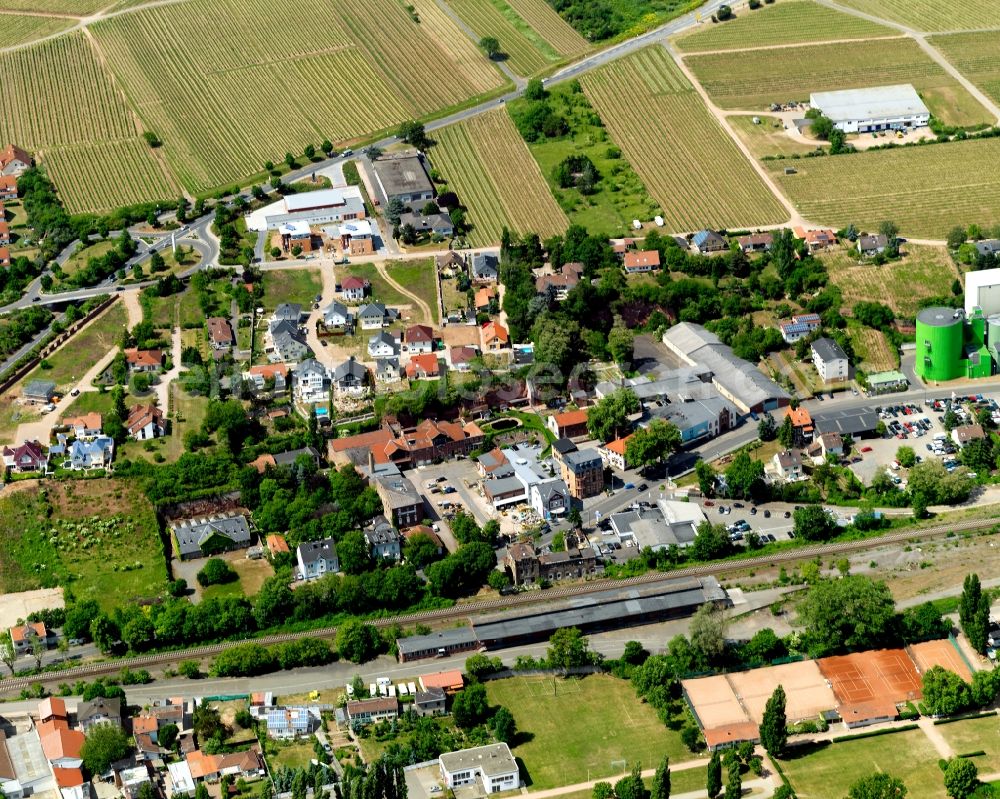 Bad Kreuznach from the bird's eye view: Agriculture, industry and residential areas in the North of Bad Kreuznach in the state of Rhineland-Palatinate. Bad Kreuznach is a spa town and county capital and is located on the rivers Nahe and Ellerbach. Apart from historic buildings and parts of the town, there are also several residential areas with multi-family homes and estates. The North of the town is characterised by industry and agricultural land