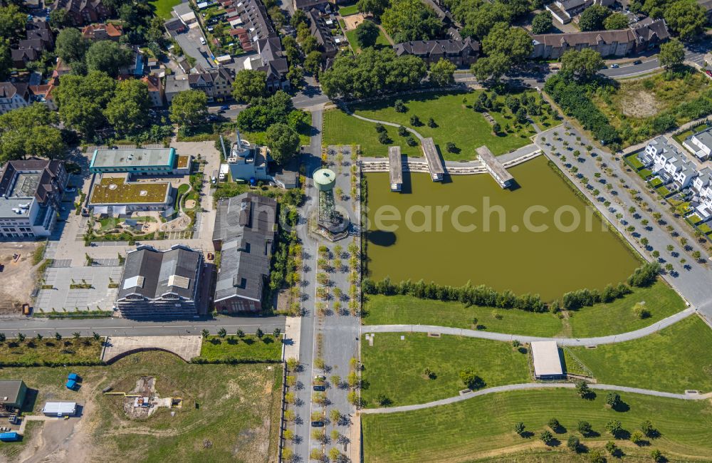 Aerial photograph Dinslaken - Building of industrial monument water tower Wasserturm Lohberg on Huenxer Strasse in Dinslaken in the state North Rhine-Westphalia, Germany