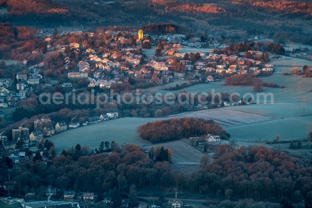 Aerial photograph Witten - Building of industrial monument water tower - yellow shining in the sunrise in the district Bommern in Witten in the state North Rhine-Westphalia