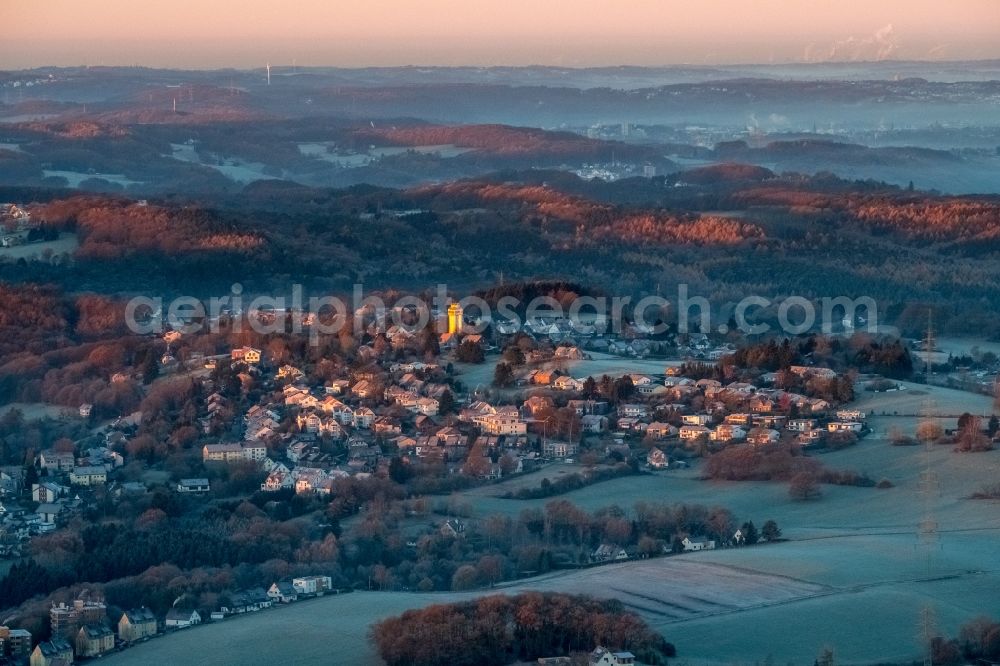 Witten from the bird's eye view: Building of industrial monument water tower - yellow shining in the sunrise in the district Bommern in Witten in the state North Rhine-Westphalia