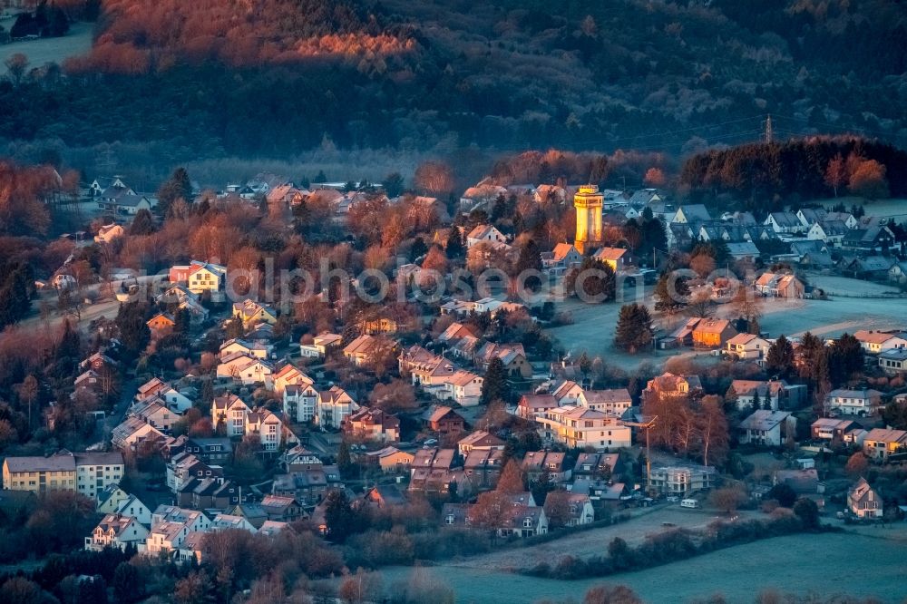 Aerial photograph Witten - Building of industrial monument water tower - yellow shining in the sunrise in the district Bommern in Witten in the state North Rhine-Westphalia