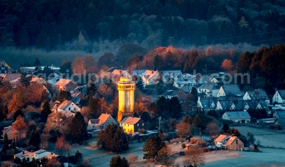 Witten from the bird's eye view: Building of industrial monument water tower - yellow shining in the sunrise in the district Bommern in Witten in the state North Rhine-Westphalia