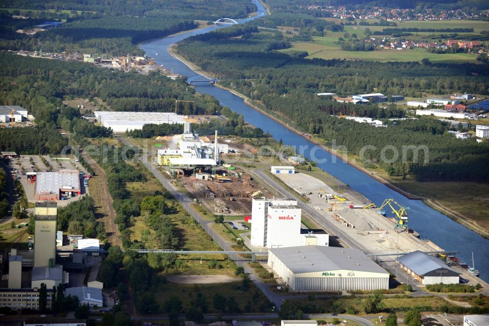 Eberswalde from the bird's eye view: Industrial area in the inland port in the city of Eberswalde Forestry on the banks of the Oder-Havel Canal in Brandenburg. In the image of the company branch Howee GmbH, HOKAWE GmbH, the DBD GmbH, a grain warehouse with conveyor bridge and a logistics center