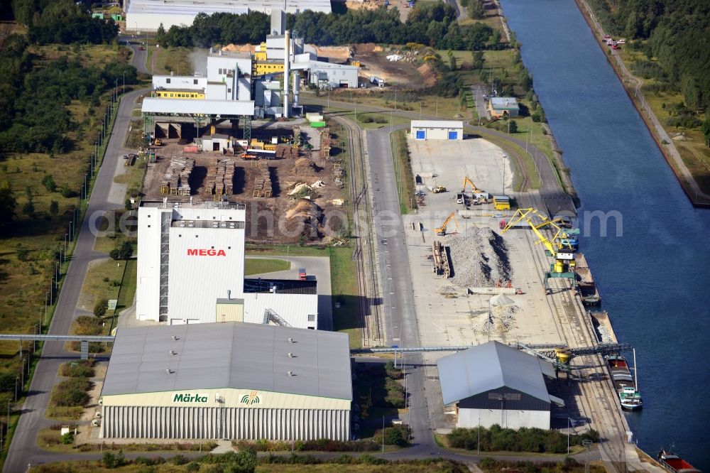 Eberswalde from the bird's eye view: Industrial area in the inland port in the city of Eberswalde Forestry on the banks of the Oder-Havel Canal in Brandenburg. In the image of the company branch Howee GmbH, HOKAWE GmbH, the DBD GmbH, a grain warehouse with conveyor bridge and a logistics center