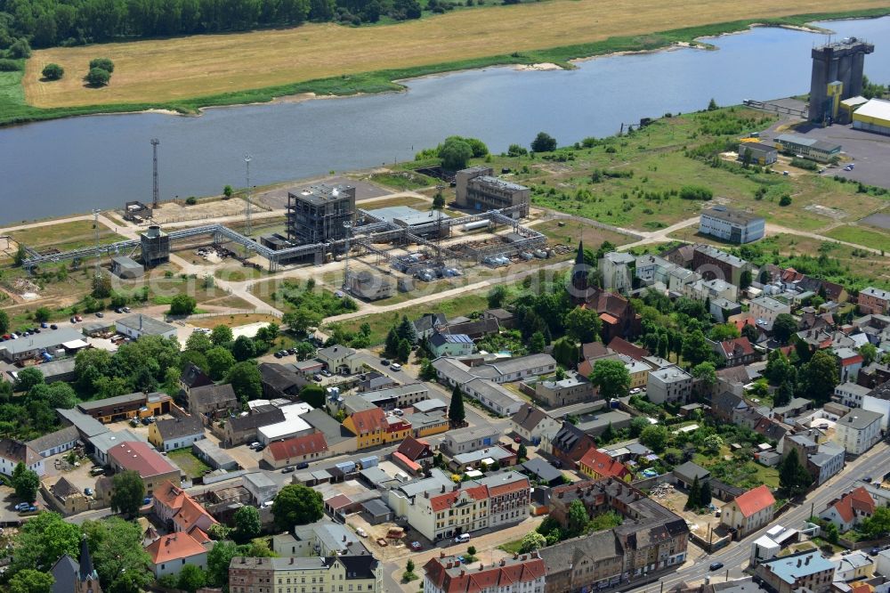 Magdeburg from above - Industrial area on the riverbank of the Elbe and former compound of Fahlberg-List in Magdeburg in the state Saxony-Anhalt.The historic buildings of the former sugar factory with its elongated hall and three silos on the riverbank are listed as protected buildings. The area belongs to the Wusterhuesen and Salbke parts in the South of Magdeburg