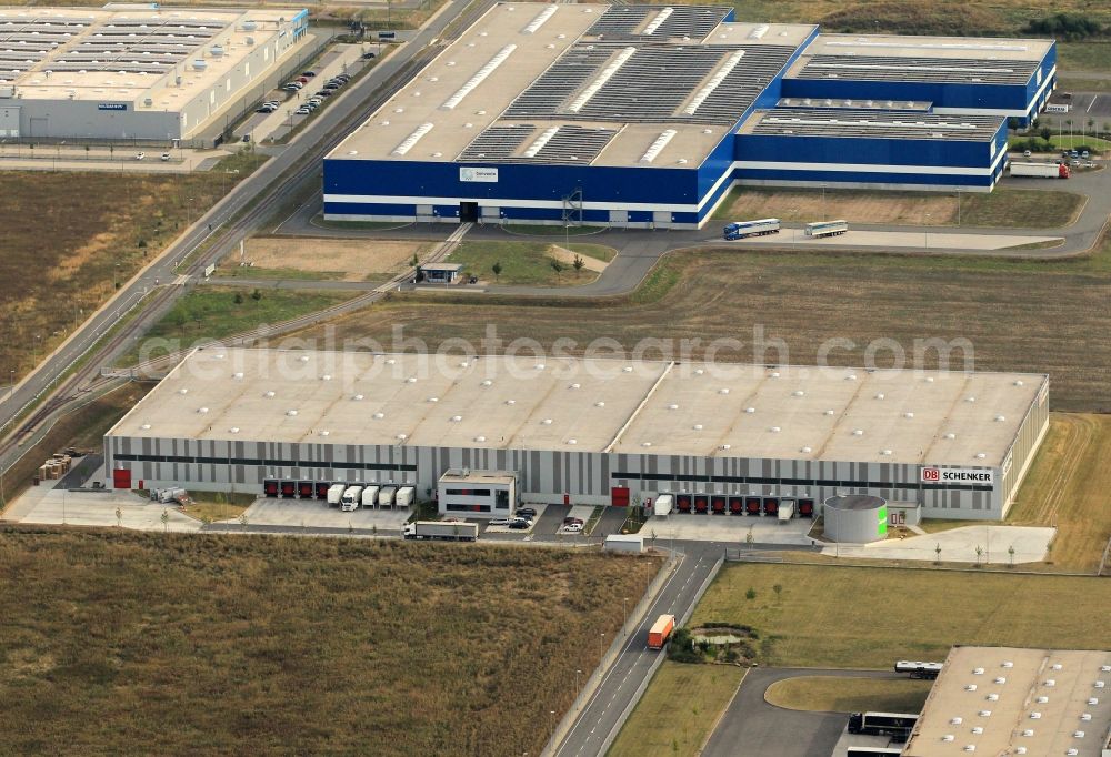 Ichtershausen from the bird's eye view: Industrial area Thoereyer Strasse withe the building of the company Spedition DB Schenker with the building of the company Gonvauto Thüringen GmbHin die background in Ichtershausen in Thuringia