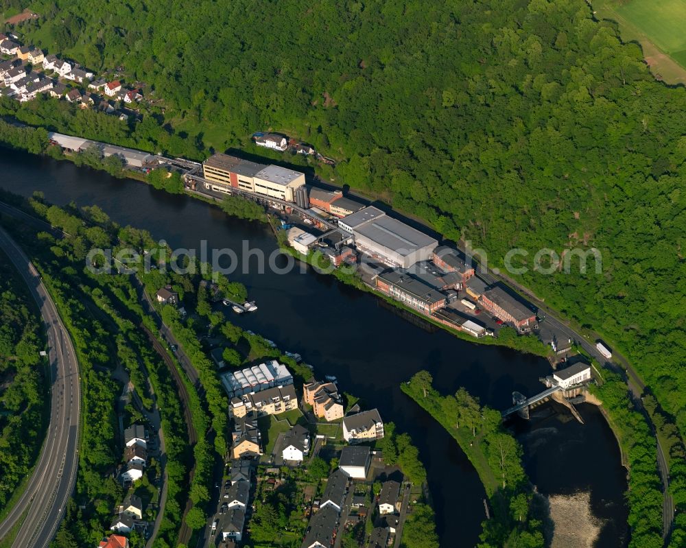 Lahnstein from above - Industrial area on the riverbank of the Lahn in Lahnstein in the state Rhineland-Palatinate. The town is located in the county district of Rhine-Lahn, at the mouth of the river Lahn into the river Rhine. The spa resort includes thermal spas and health centres and sits in the UNESCO world heritage site of Upper Middle Rhine Valley. The industrial area is located in the East of the town centre and includes the works of Clariant GmbH, a plastics and mineral oil producer