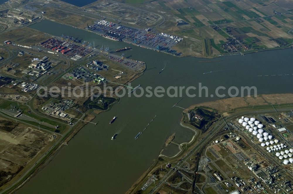 Aerial photograph Antwerpen - Industrial areas, logistics centers and fuel storage on the banks of the Scheldt flux flow with the two ancient fortifications Fort Liefenshoekin and Lillo-Fort in Antwerp, Belgium